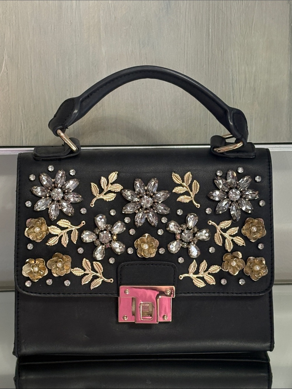 Vintage Black Top-Handle Satchel with Gold Floral Embellishments and Pink Clasp